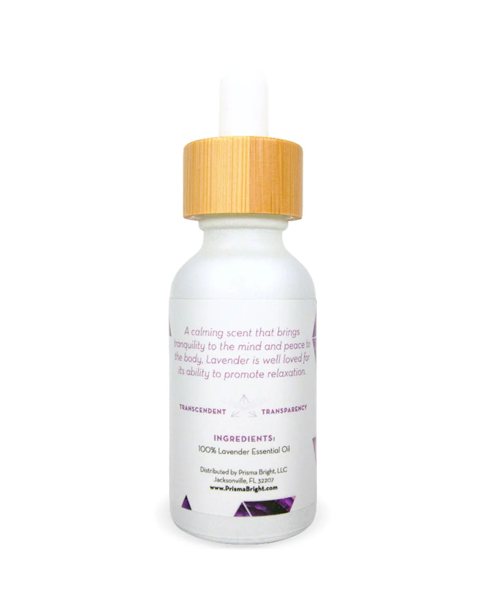 Front view photo of a Prisma Lavender Essential Oil bottle showing a white bottle with a white and purple metallic label. Bottle has a bamboo lid with a white dropper on top. Background is white.